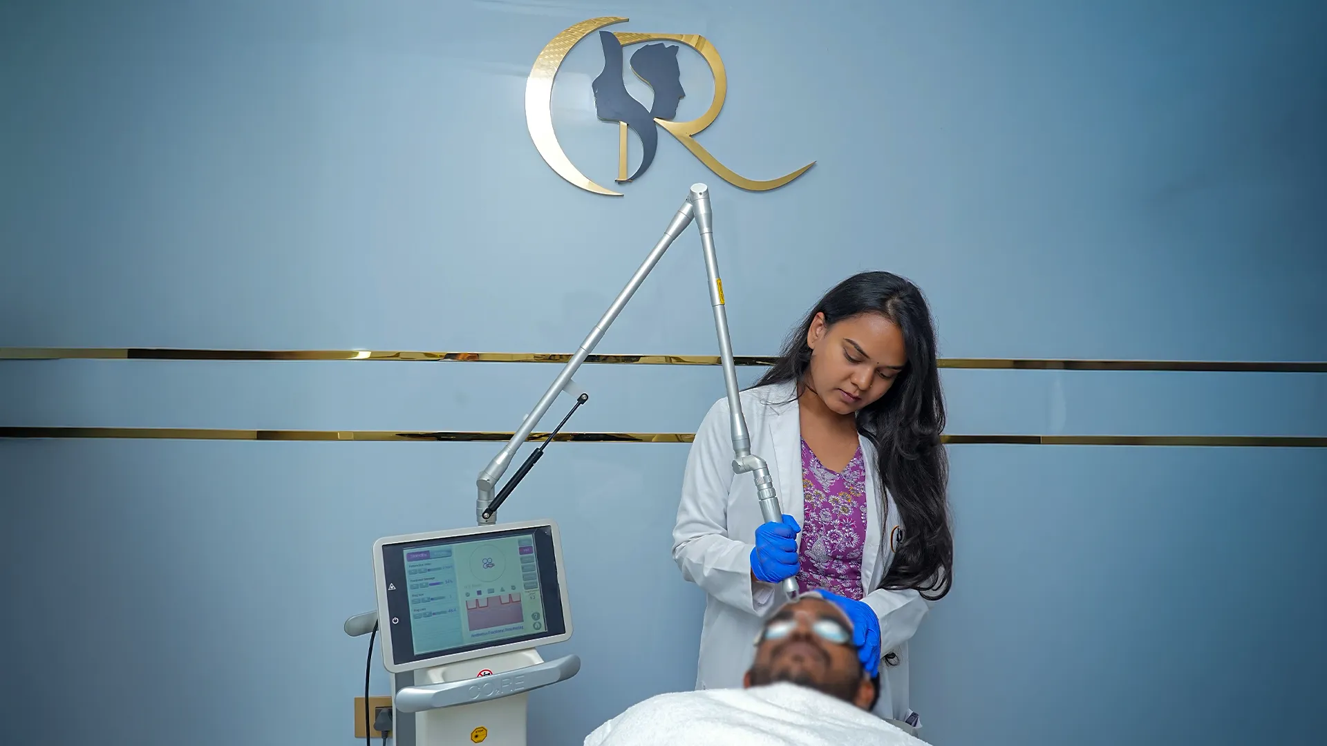 Dermatologist performing fractional CO2 laser resurfacing using Candela CO2RE device