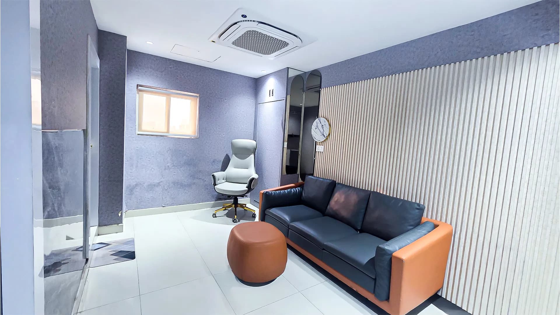 Exclusive Doctor's Lounge featuring a modern massage chair, comfortable sofa seating, and private relaxation area