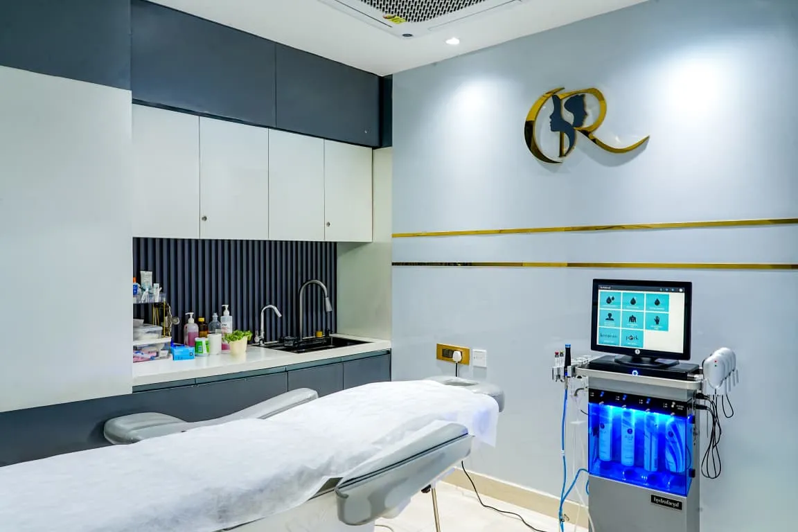 Procedure room equipped with Hydrafacial Elite device and a fully electric remote 5-function dermatology bed
