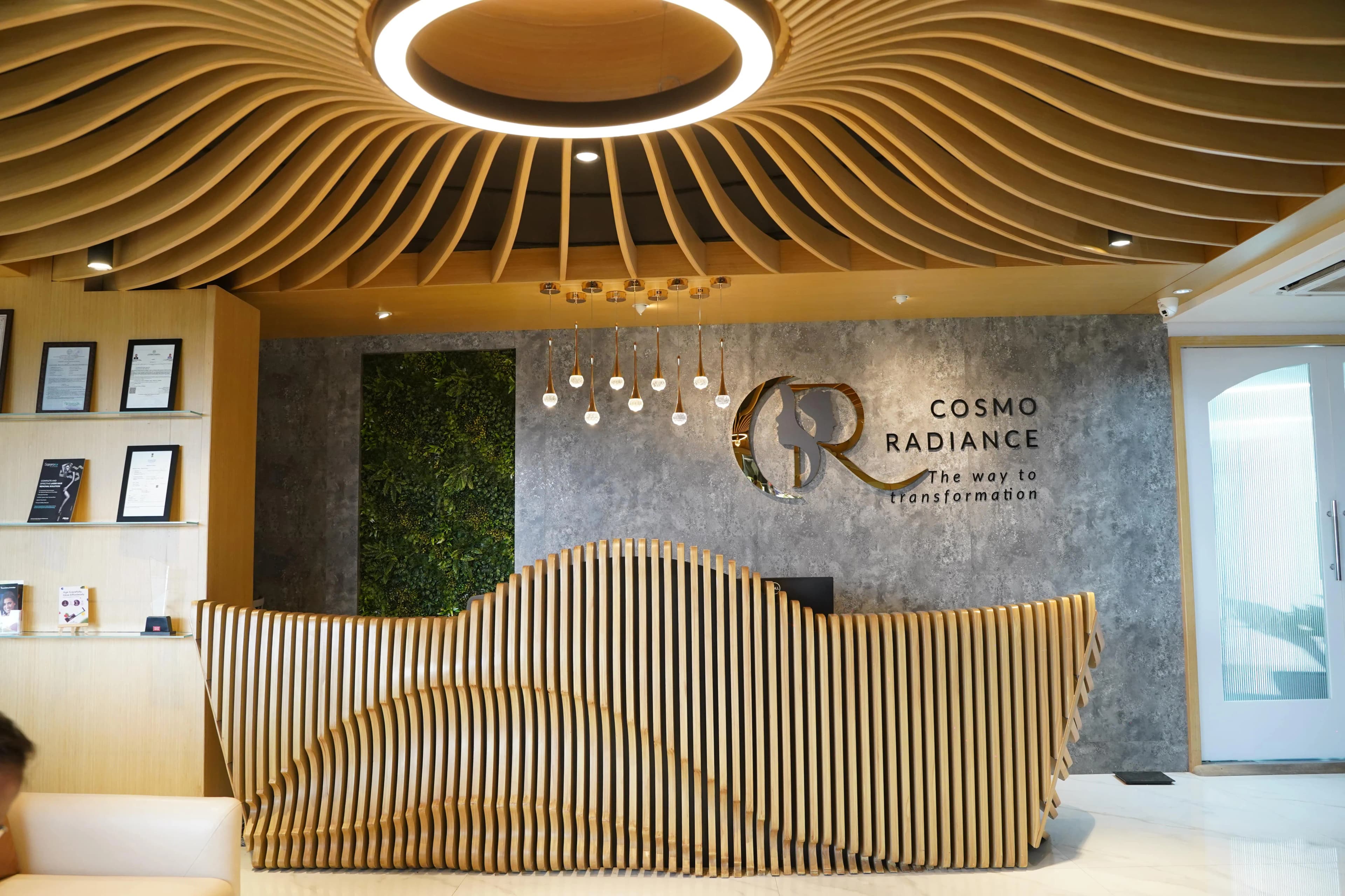 Front reception desk at Cosmo Radiance featuring custom parametric design, managed by Anzer IT Healthcare Asia software