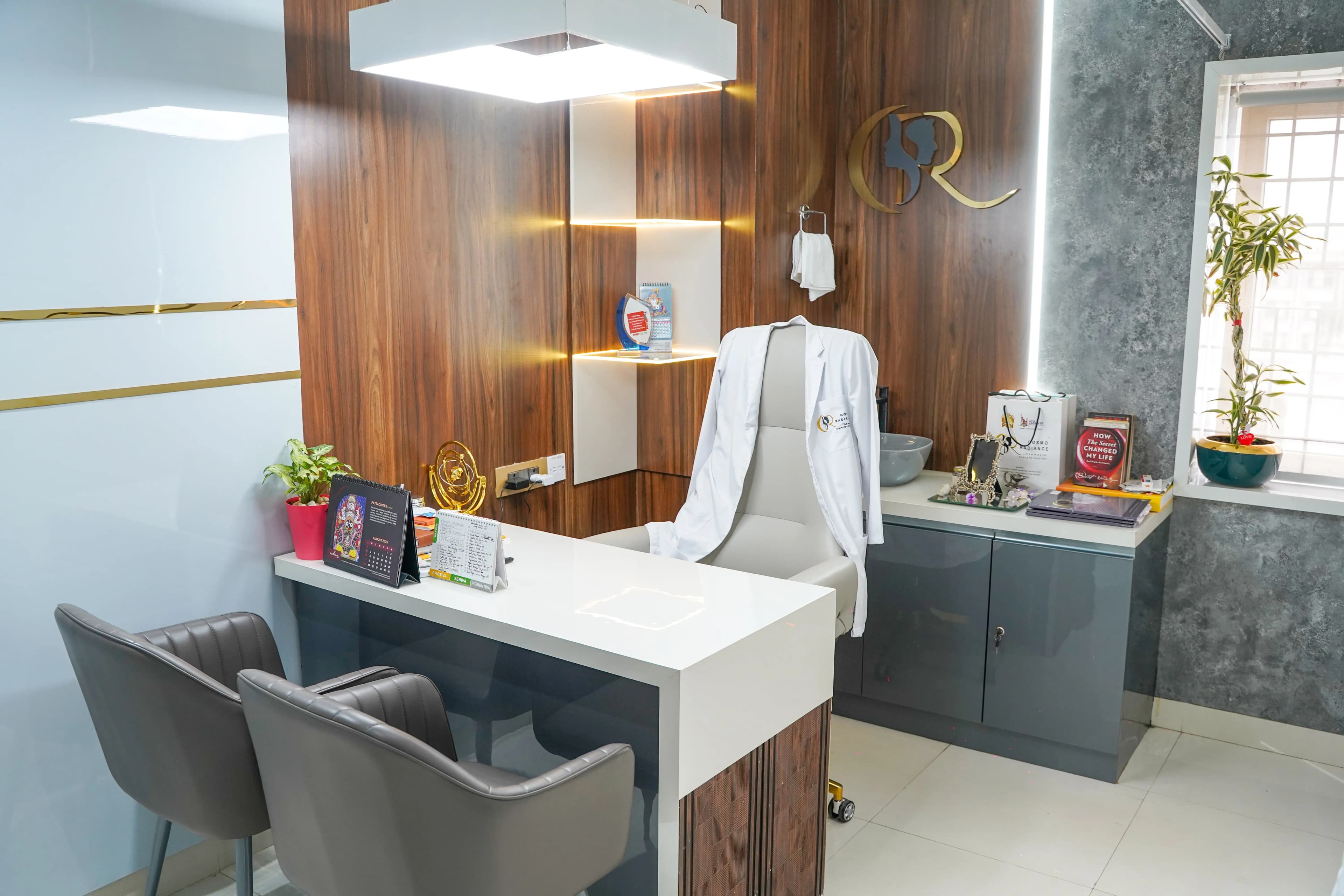Private doctor consultation room with white desk and modern decor